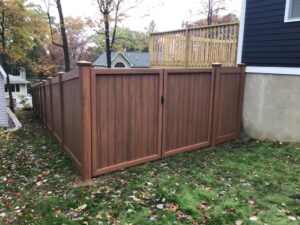 Beautiful dark wood fence on residential property